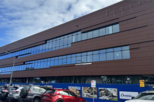 View of southern façade now nearing completion and works continuing on east and north facing panels.