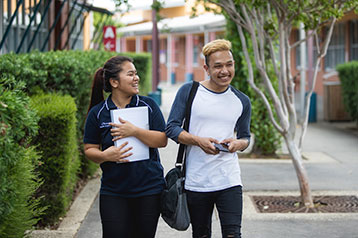 student walking through campus