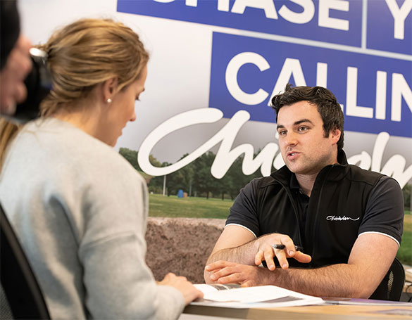 A male student having a consultation with a support staff.